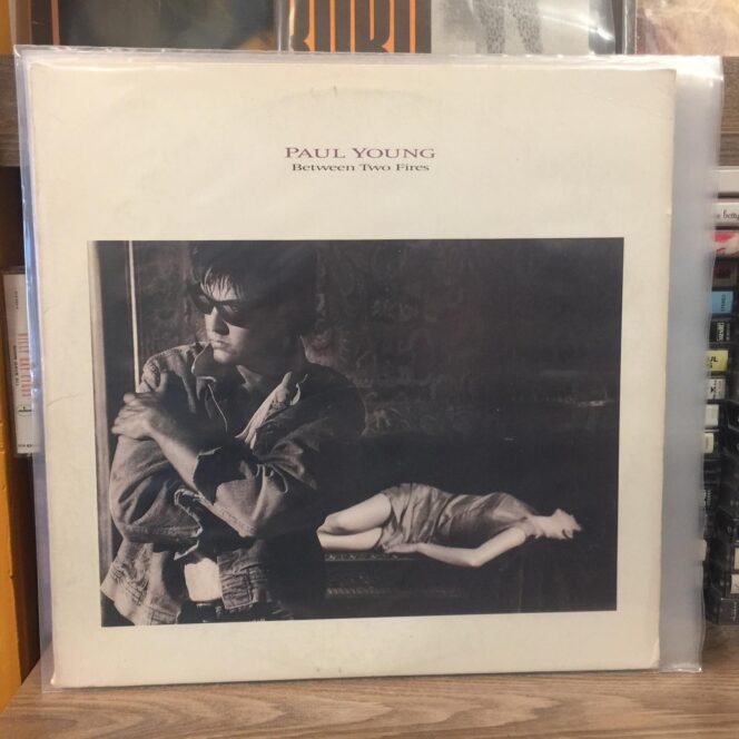 PAUL YOUNG - BETWEEN TWO FIRES LP